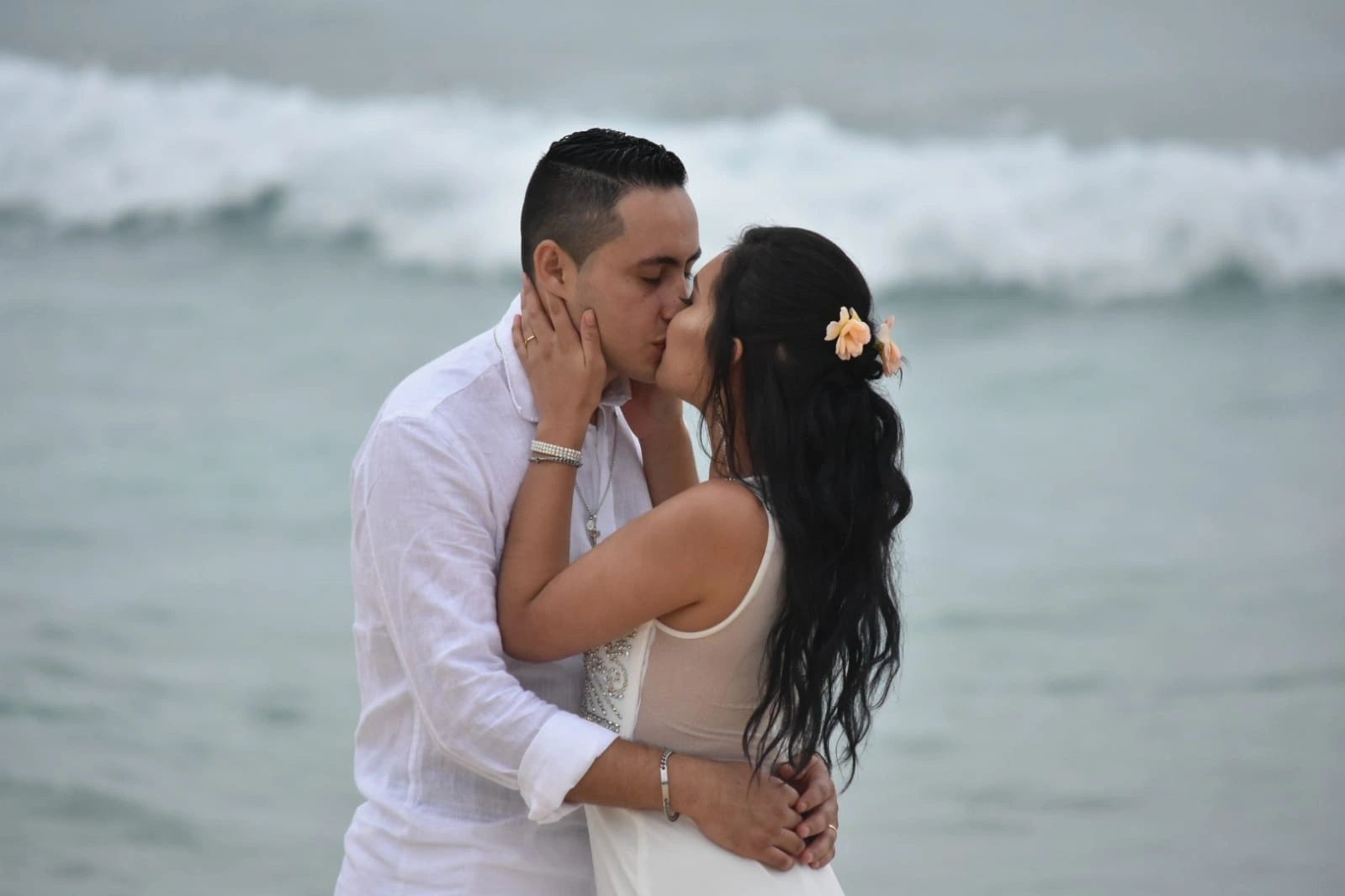 A happy wedding couple celebrating on the beach